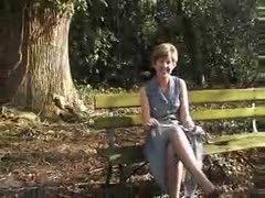 In a public park, a shameless elder honey flaunts her voluptuous figure.